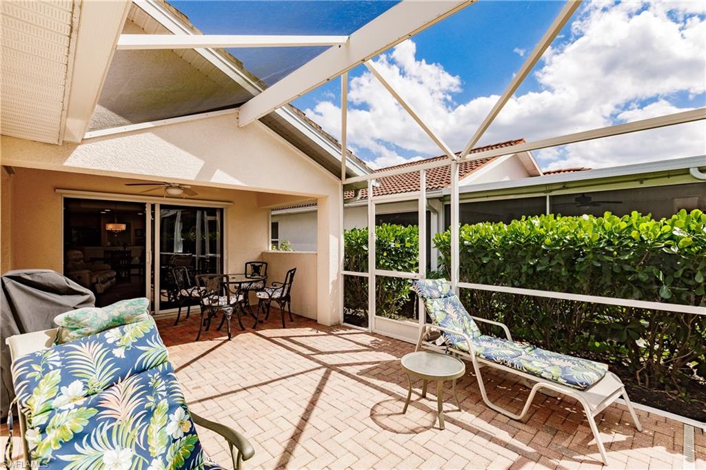 19628 Villa Rosa Loop Estero, FL 33967 - Photo 24 of 25 a view of a patio with table and chairs and potted plants