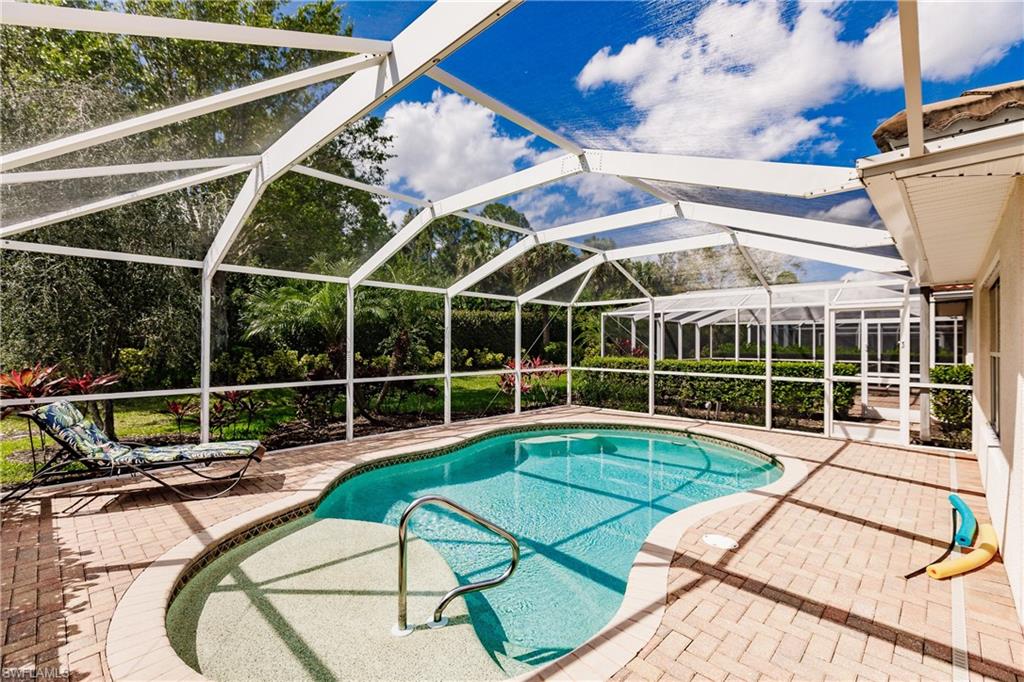 19628 Villa Rosa Loop Estero, FL 33967 - Photo 25 of 25 a view of a swimming pool with a couches and wooden floor