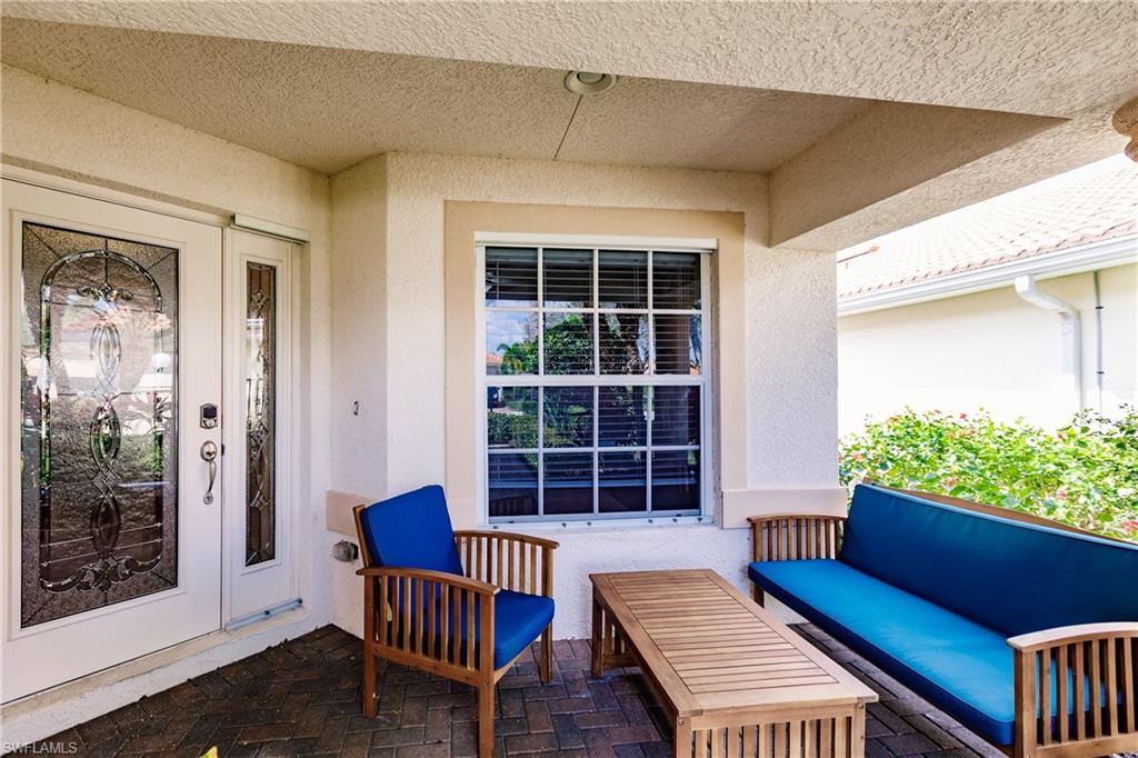 19628 Villa Rosa Loop Estero, FL 33967 - Photo 3 of 25 a view of a lounge chairs in the porch