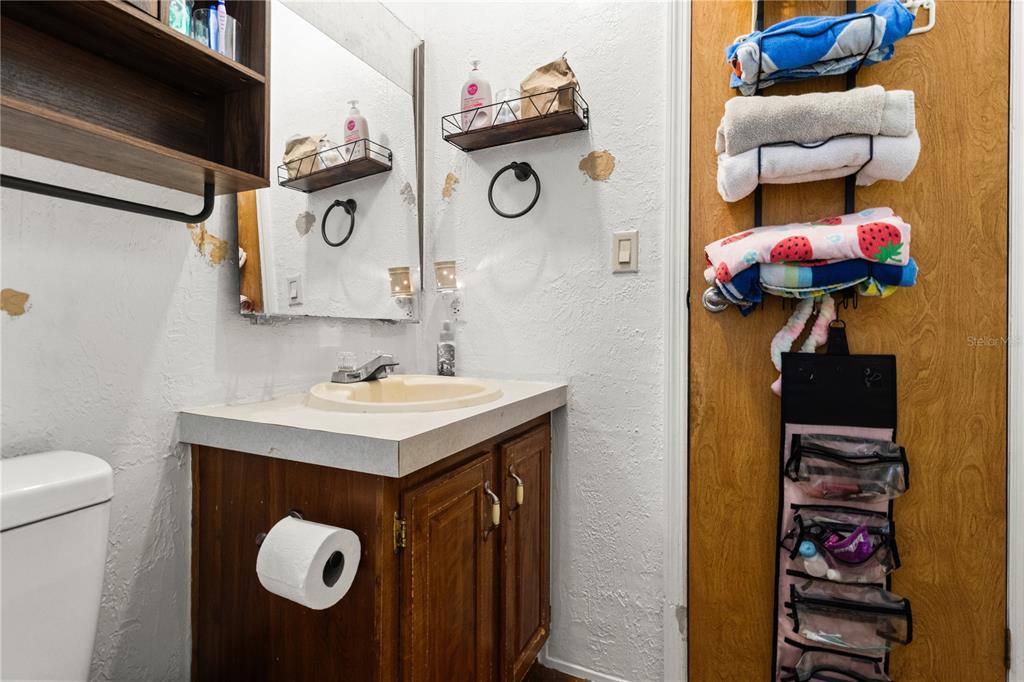 14930 Southeast 2 Lane Williston, FL 32696 - Photo 19 of 20 a bathroom with a sink and a mirror