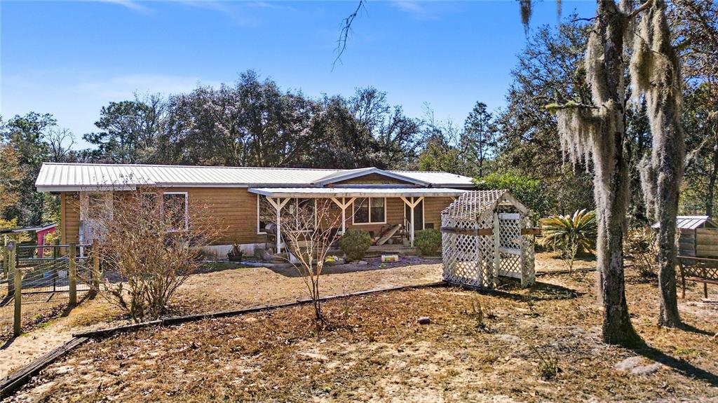 14930 Southeast 2 Lane Williston, FL 32696 - Photo 2 of 20 a view of a patio with a yard