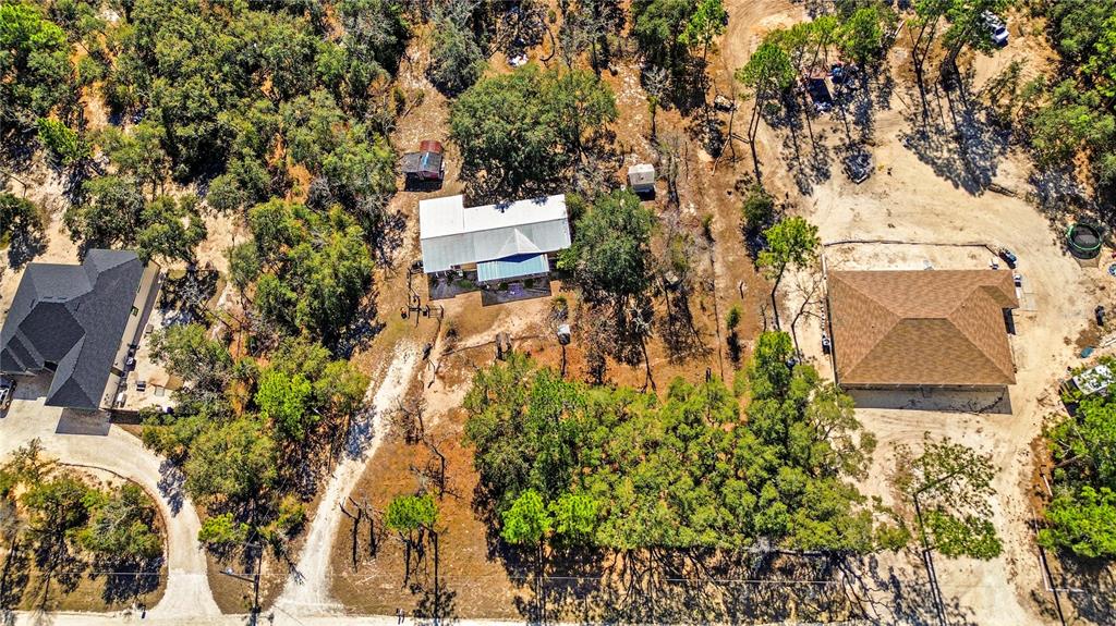 14930 Southeast 2 Lane Williston, FL 32696 - Photo 4 of 20 an aerial view of residential house with outdoor space and trees all around