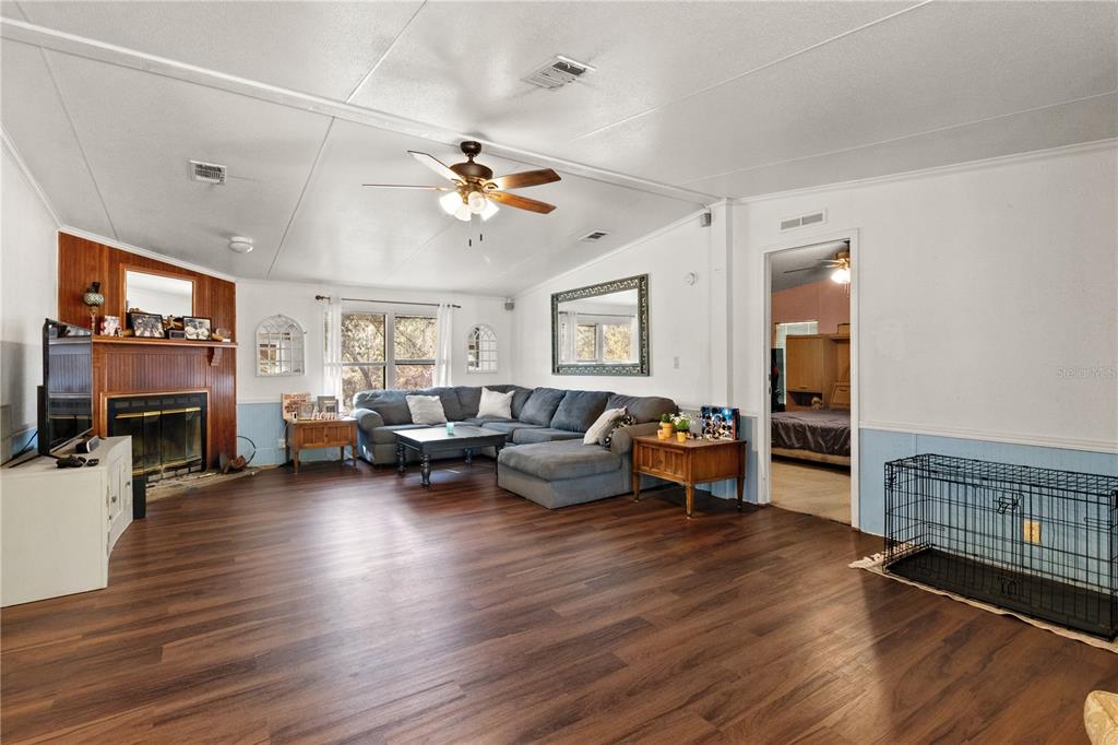 14930 Southeast 2 Lane Williston, FL 32696 - Photo 6 of 20 a living room with furniture and wooden floor