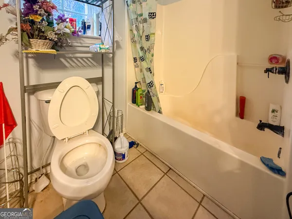 a bathroom with a toilet and a sink