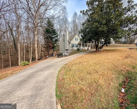 a swimming pool with trees in front of it
