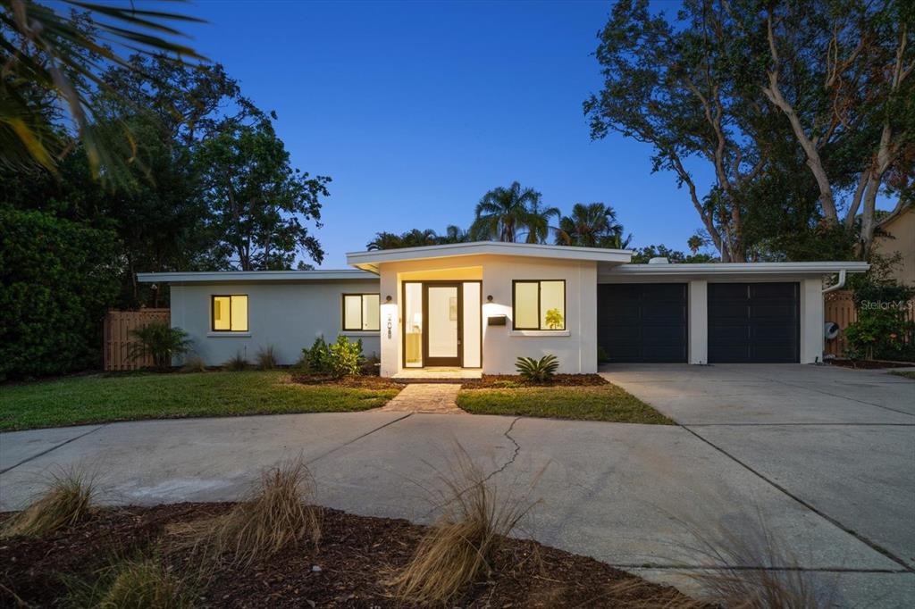208 Mehlenbacher Road Belleair, FL 33756 - Photo 1 of 1 a front view of a house with a yard