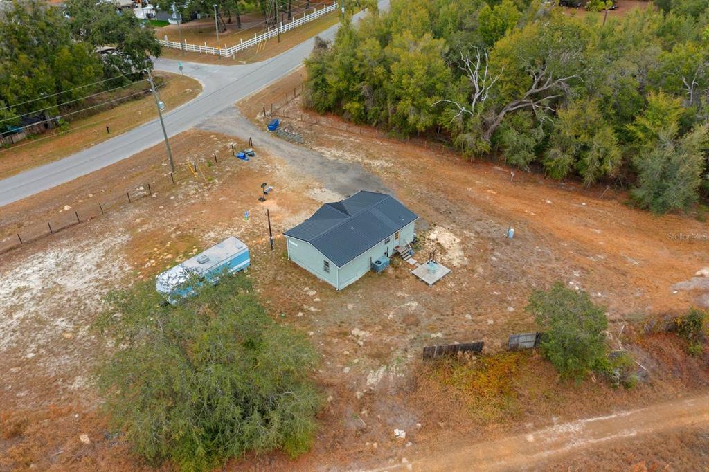 17558 Caufield Road Spring Hill, FL 34610 - Photo 17 of 20 a view of a street with a yard