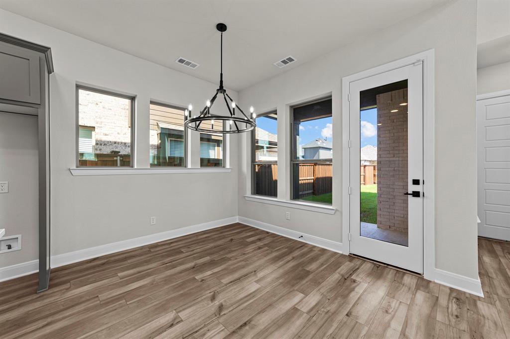 2044 Cuellar Way Van Alstyne, TX 75495 - Photo 20 of 30 a view of empty room with wooden floor and fan