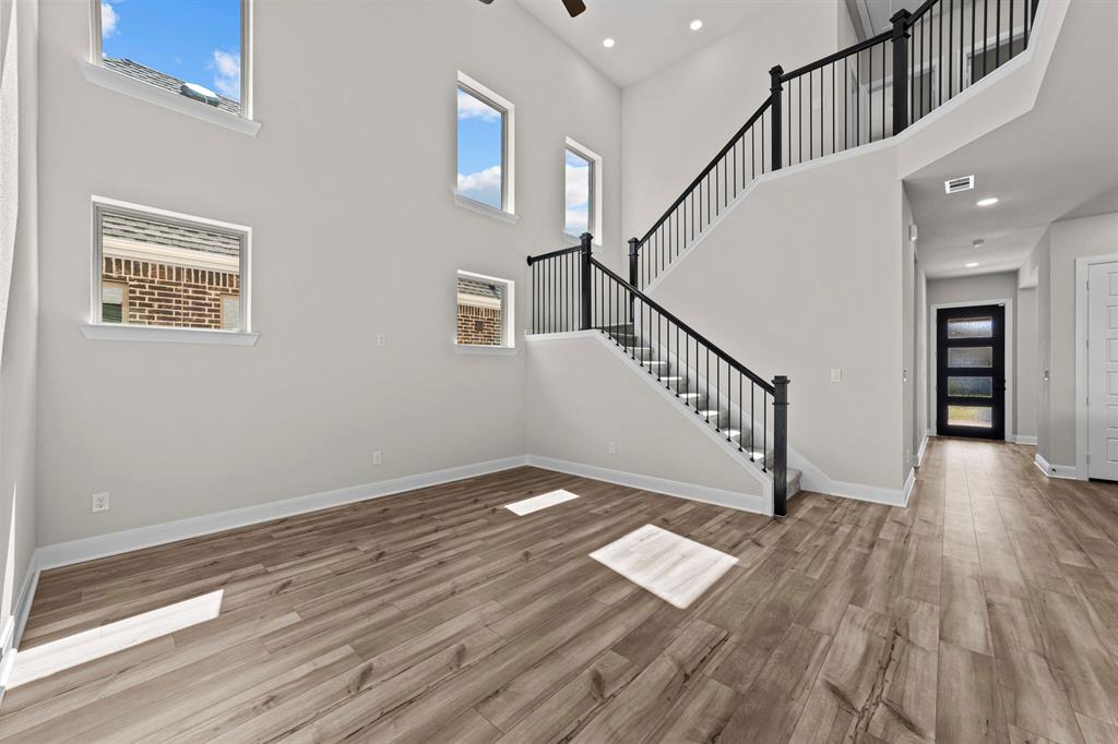 2044 Cuellar Way Van Alstyne, TX 75495 - Photo 6 of 30 a view of entryway with wooden floor and stairs