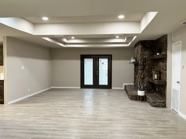 a view of livingroom with a large mirror and couch