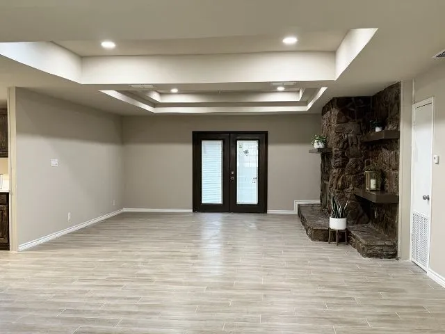 a view of livingroom with a large mirror and couch