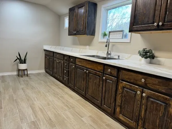 a kitchen with a sink and cabinets