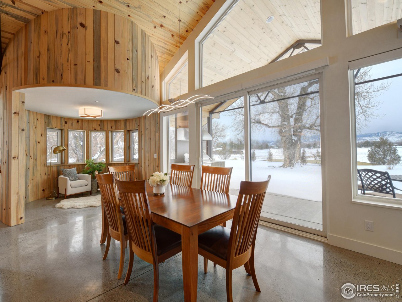 6077 Jay Road Boulder, CO 80301 - Photo 12 of 35 a dining room with furniture a chandelier and wooden floor