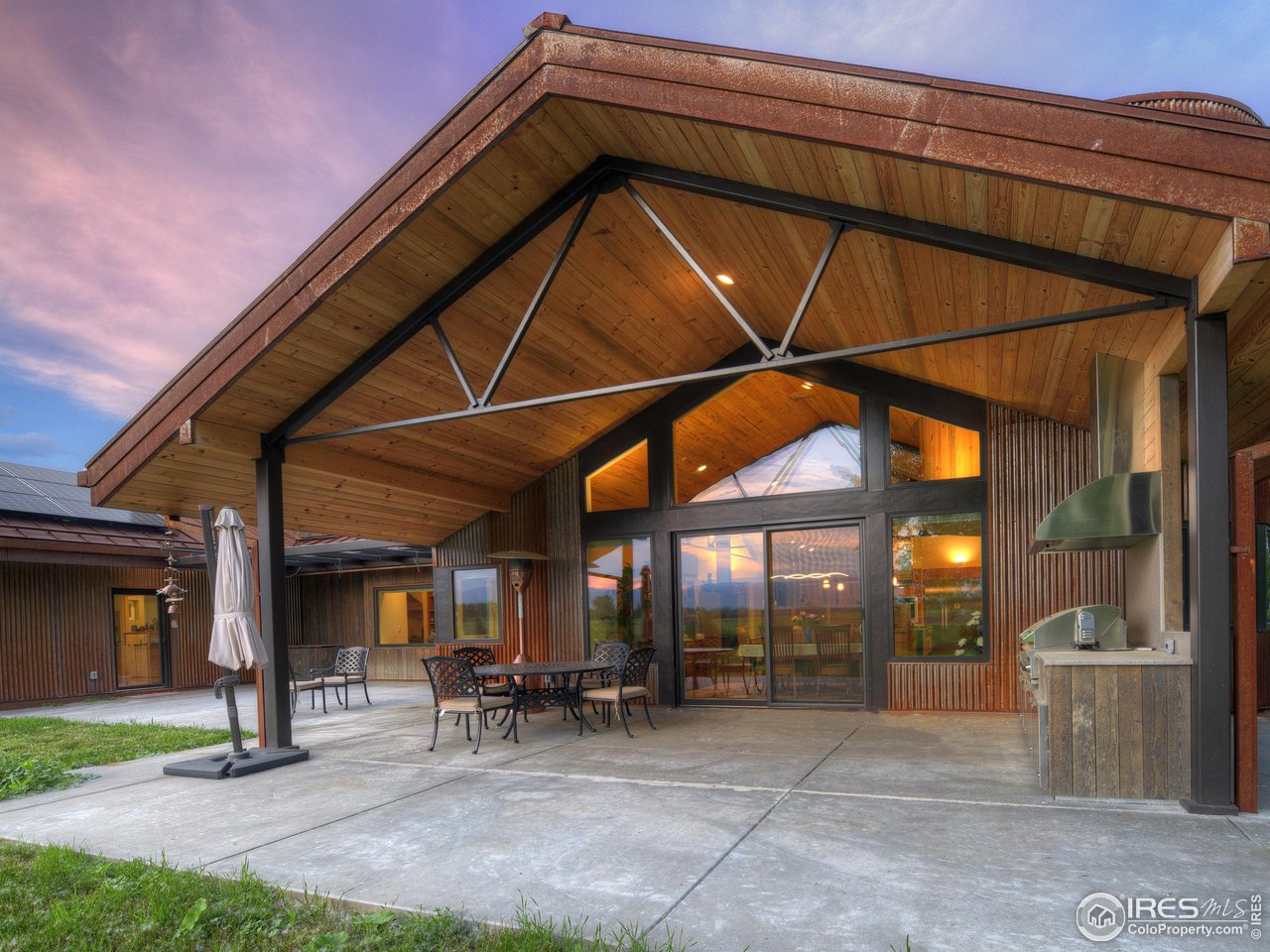 6077 Jay Road Boulder, CO 80301 - Photo 13 of 35 a view of a patio with table and chairs under an umbrella