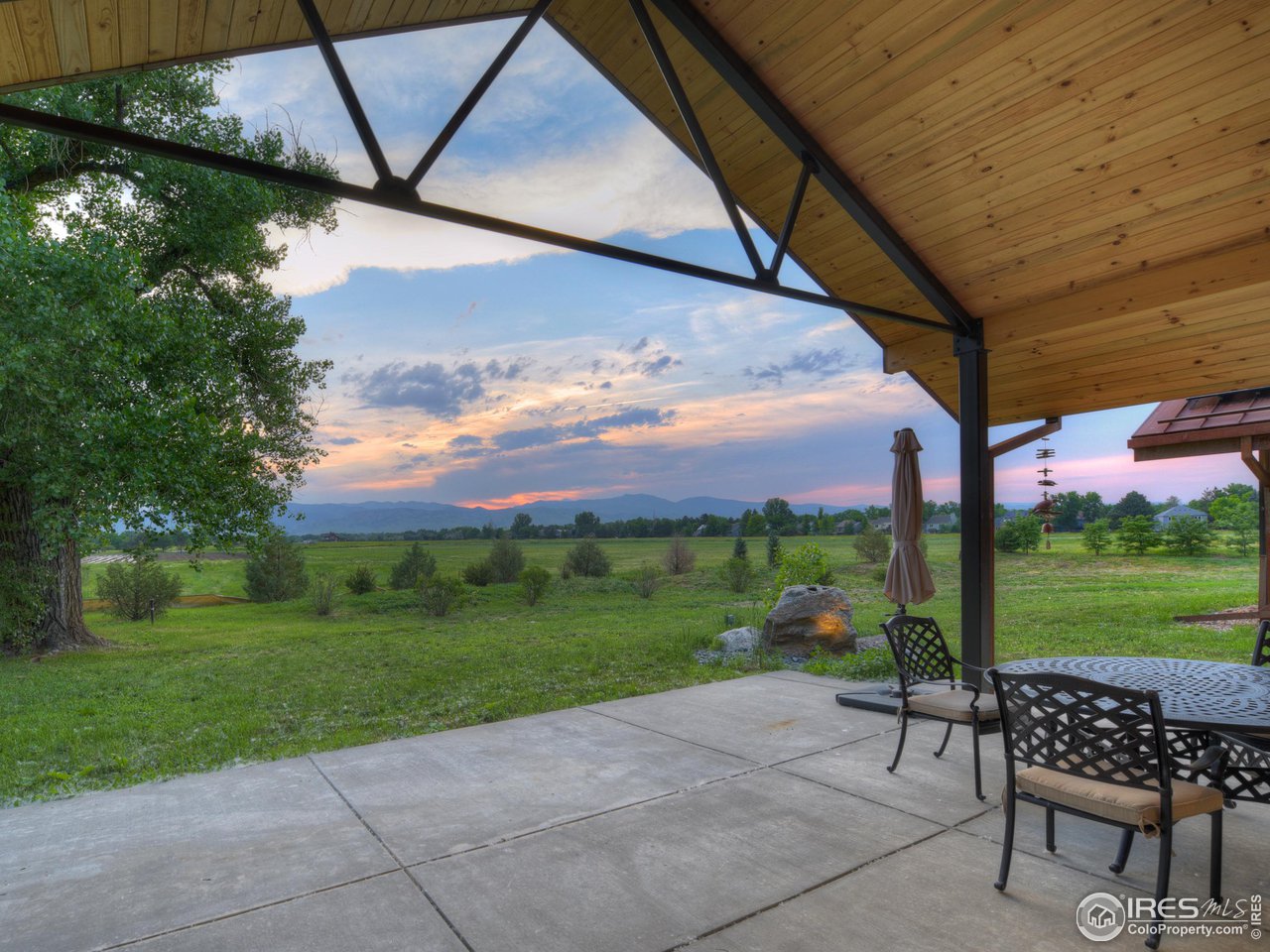 6077 Jay Road Boulder, CO 80301 - Photo 14 of 35 a view of a patio with a table chairs and a yard