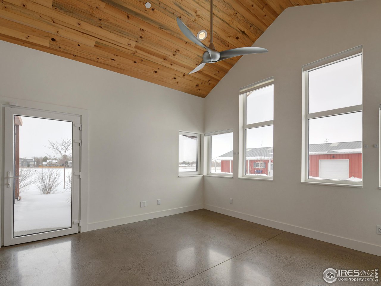 6077 Jay Road Boulder, CO 80301 - Photo 21 of 35 an empty room with wooden floor and windows