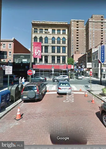 a view of a street with cars