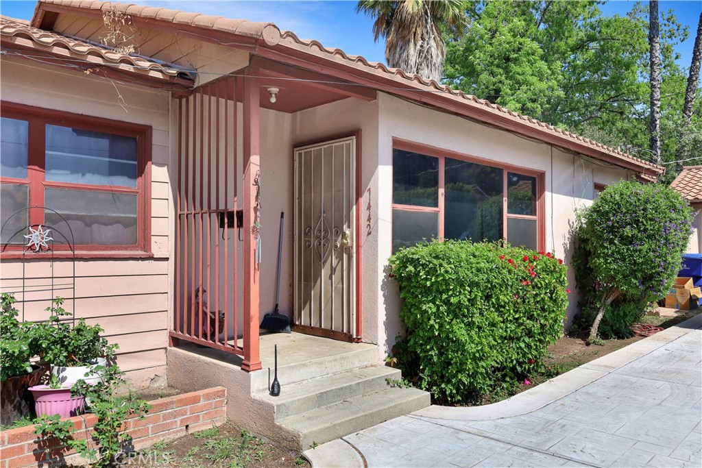 7442 Potomac Street Riverside, CA 92504 - Photo 1 of 7 a front view of a house with garden
