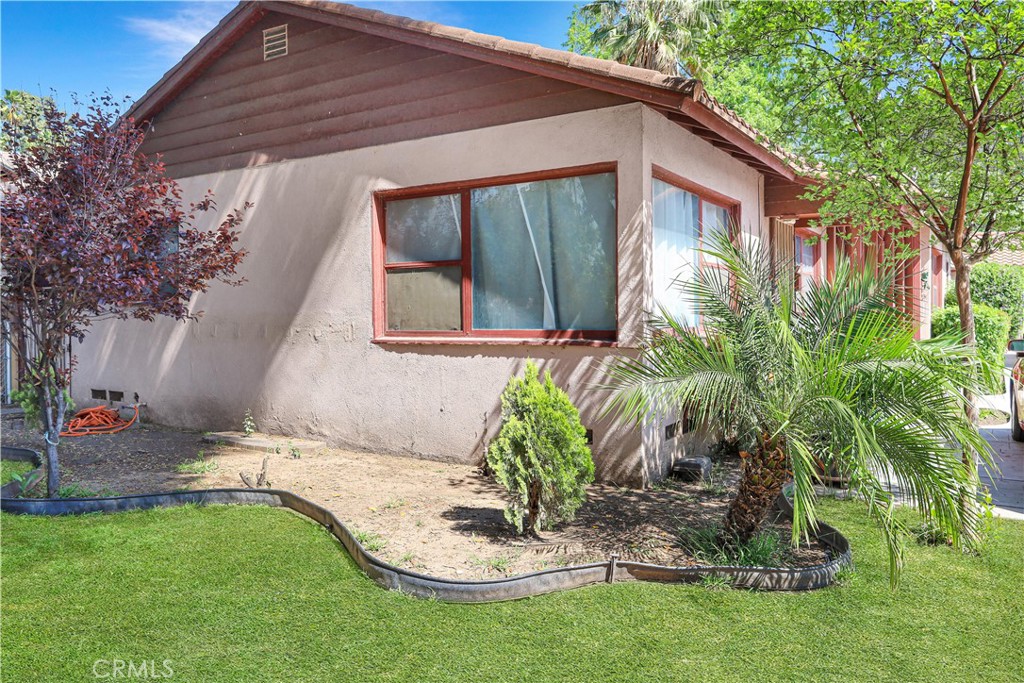 7442 Potomac Street Riverside, CA 92504 - Photo 6 of 7 a front view of a house with a yard