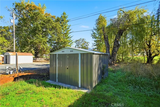 a view of a backyard of the house