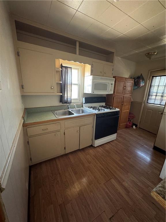 110 13th Street Conway, PA 15027 - Photo 5 of 6 a kitchen with stainless steel appliances granite countertop a sink and a stove top oven