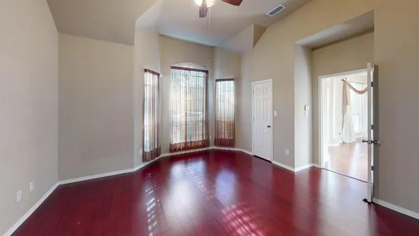 an empty room with entrance door