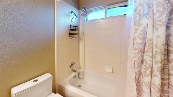 a spacious bathroom with a granite countertop sink and a mirror