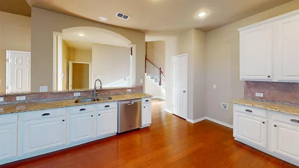 a large bathroom with a sink and a large mirror