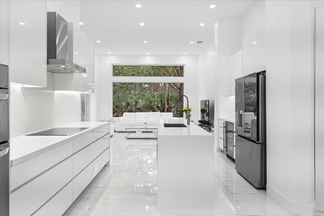 a kitchen with a refrigerator and a sink