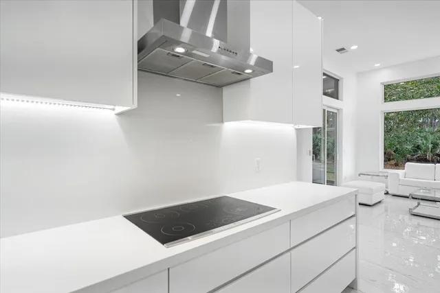 a kitchen with a sink and a large window