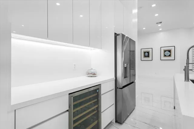 a living room with furniture and large windows