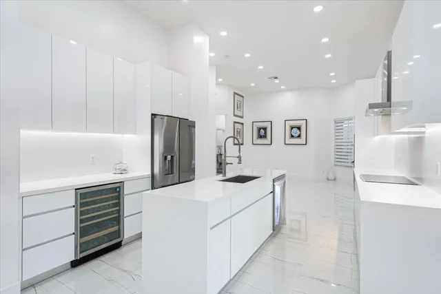 a living room with furniture and large windows