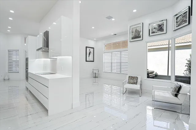 a view of a living room a rug and white walls