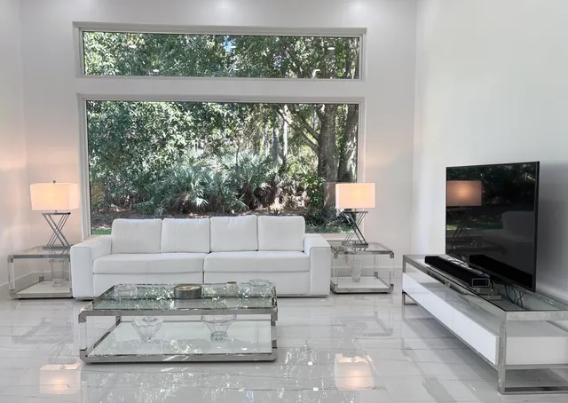 a bathroom with a double vanity sink mirror and toilet