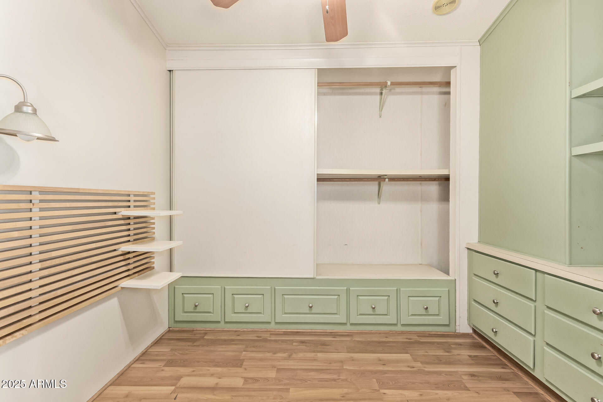 111 South Greenfield Road, Unit 647 Mesa, AZ 85206 - Photo 17 of 29 a view of a closet area with wooden floor
