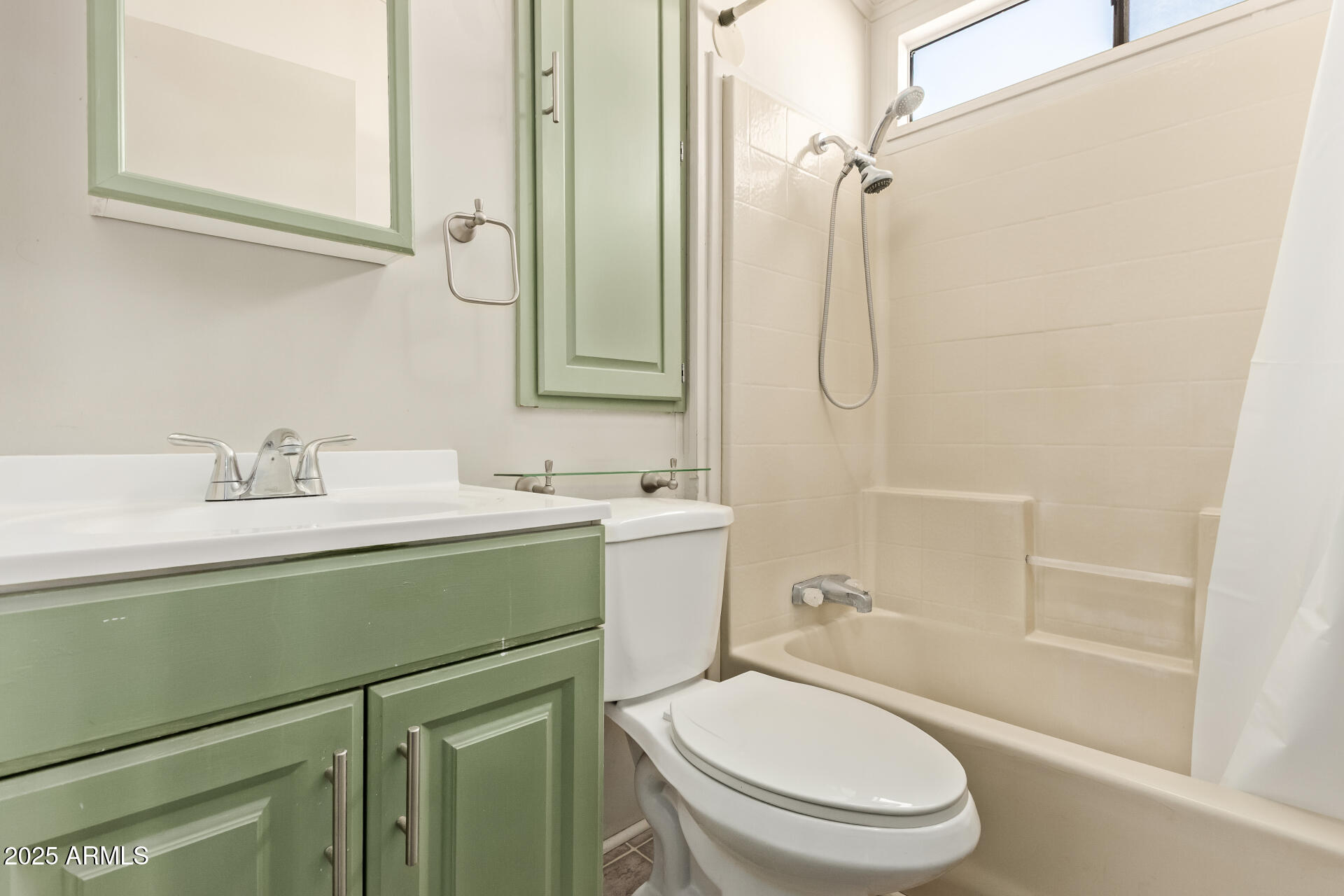 111 South Greenfield Road, Unit 647 Mesa, AZ 85206 - Photo 18 of 29 a bathroom with a sink toilet and shower