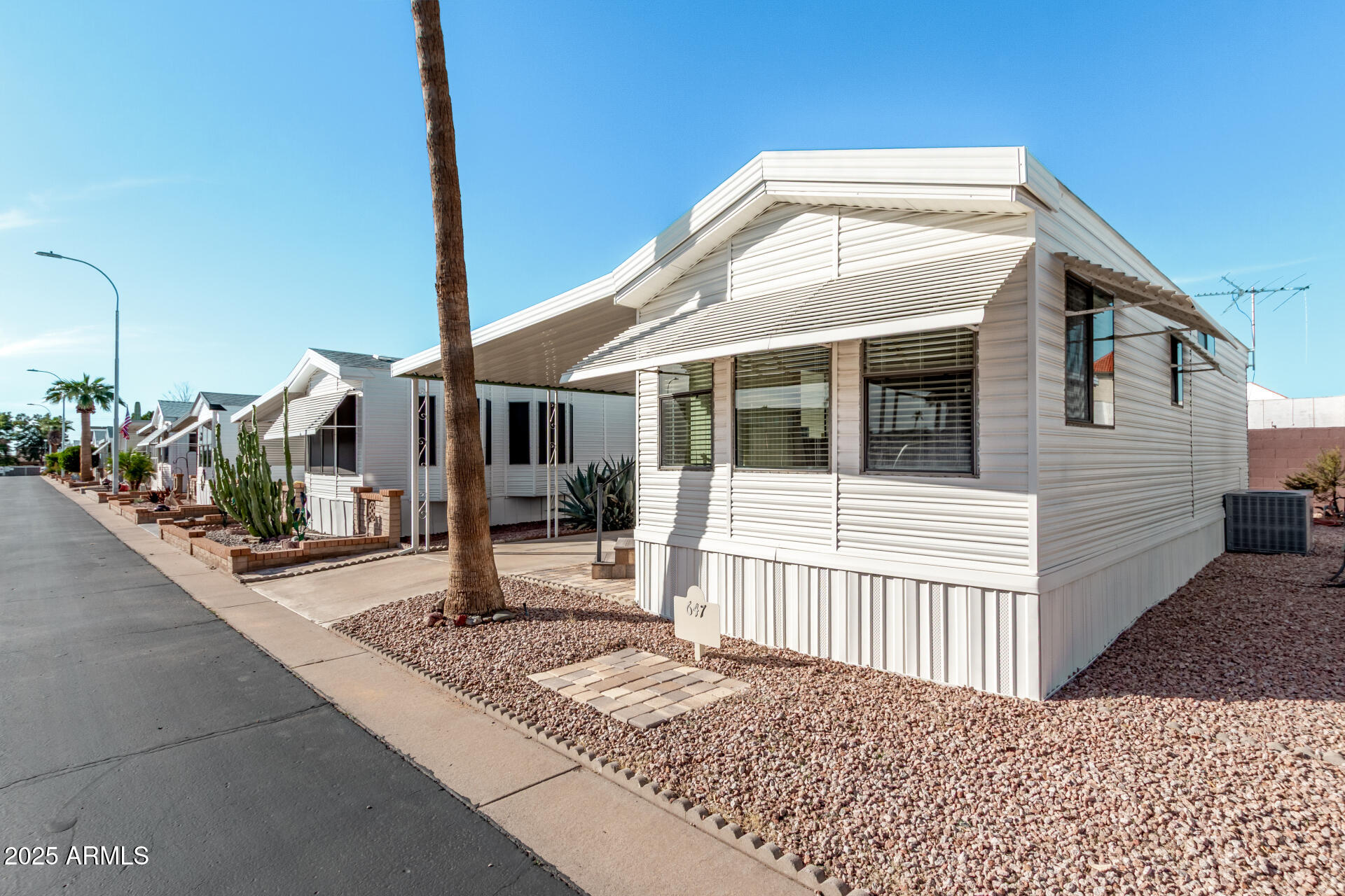 111 South Greenfield Road, Unit 647 Mesa, AZ 85206 - Photo 6 of 29 a front view of a house with a porch
