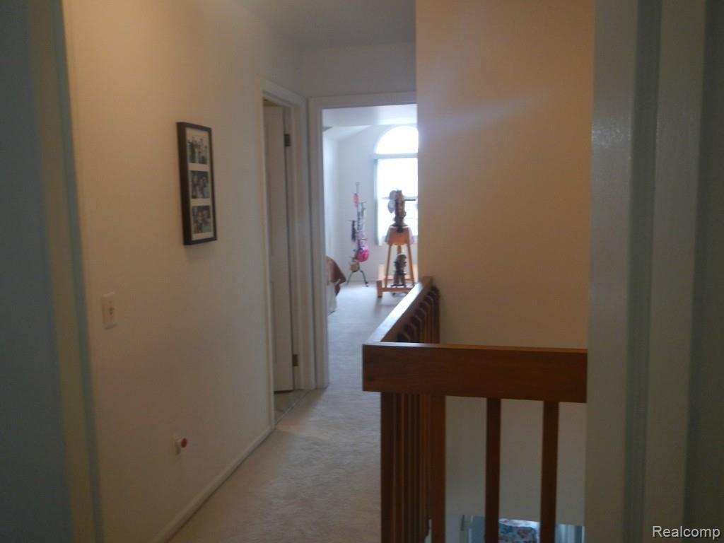629 Summit Ridge Drive, Unit 13 Milford, MI 48381 - Photo 23 of 59 Hall way to 2 and 3 bedrooms