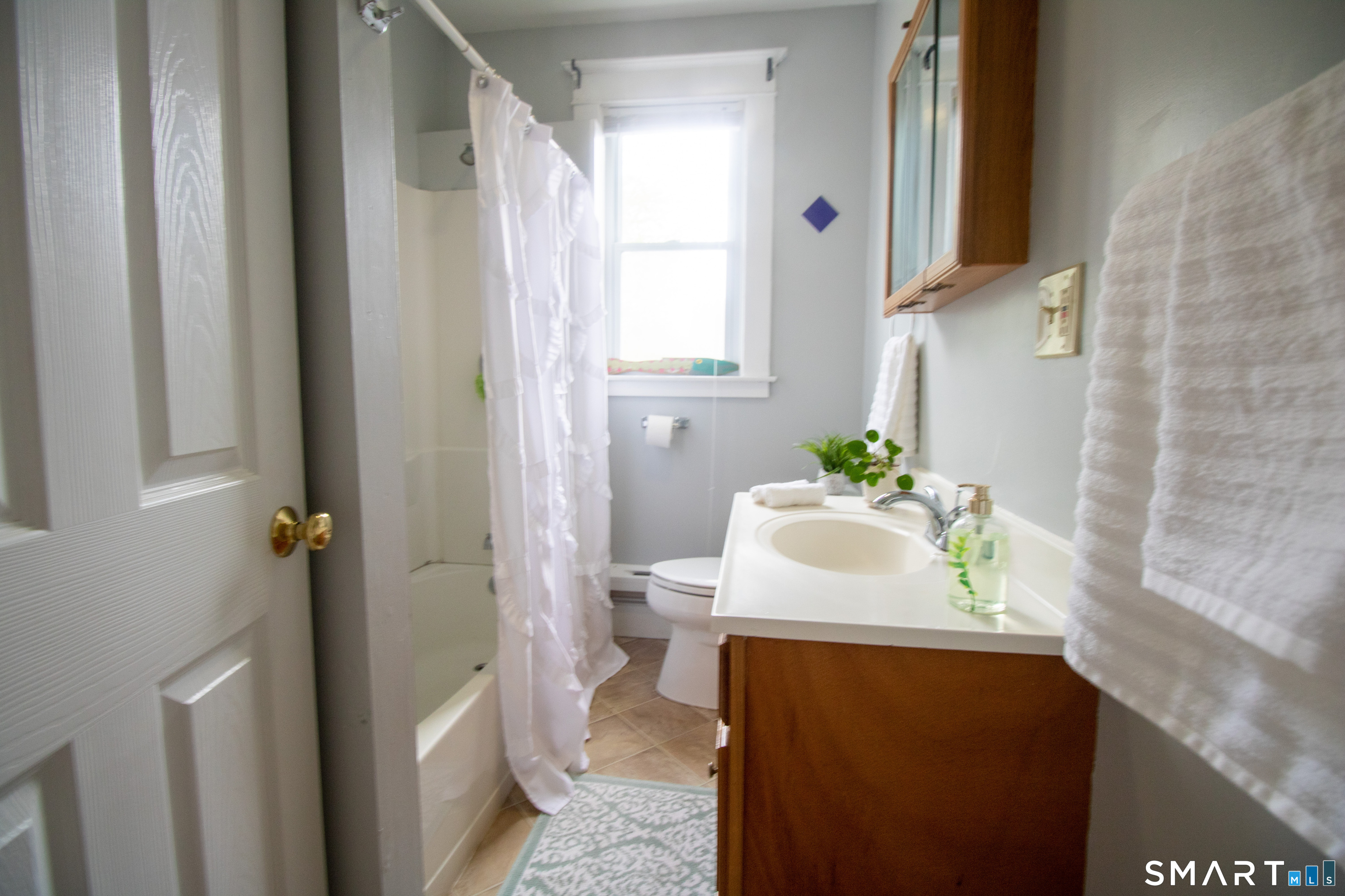 88 Riverview Avenue New London, CT 06320 - Photo 4 of 6 a bathroom with a sink and a mirror