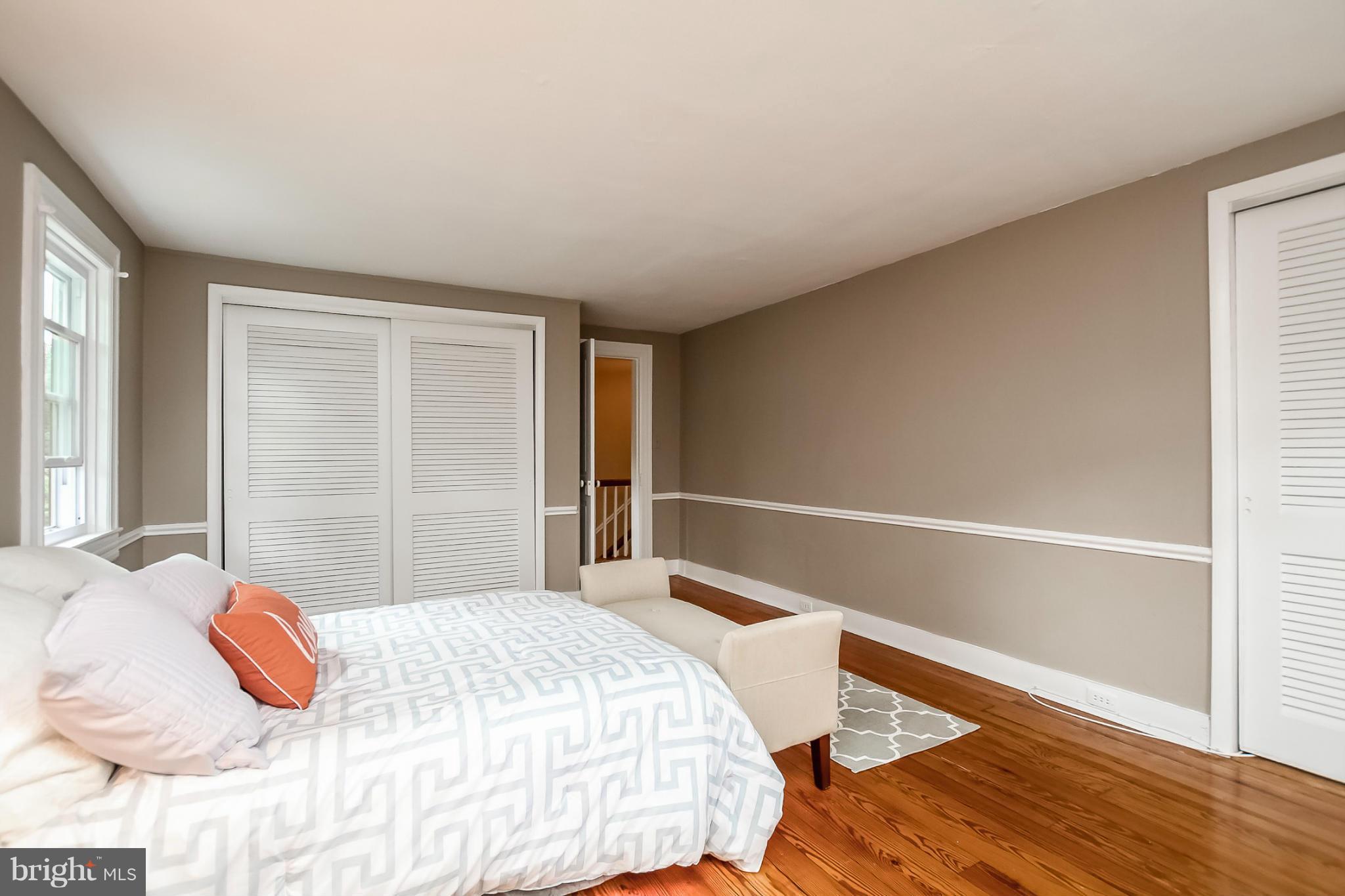 2429 Stanwick Road Phoenix, MD 21131 - Photo 15 of 30 a bedroom with a bed and wooden floor