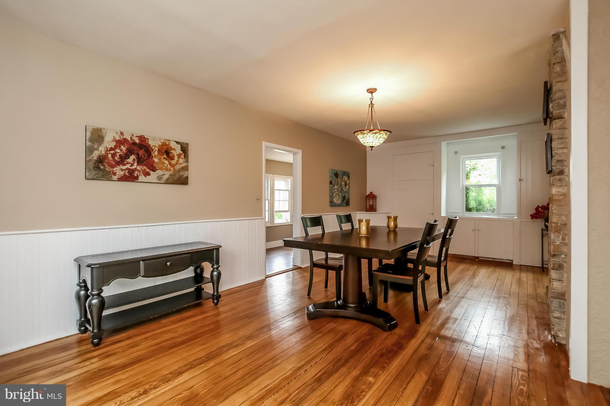 2429 Stanwick Road Phoenix, MD 21131 - Photo 7 of 30 a view of a dining room with furniture and wooden floor
