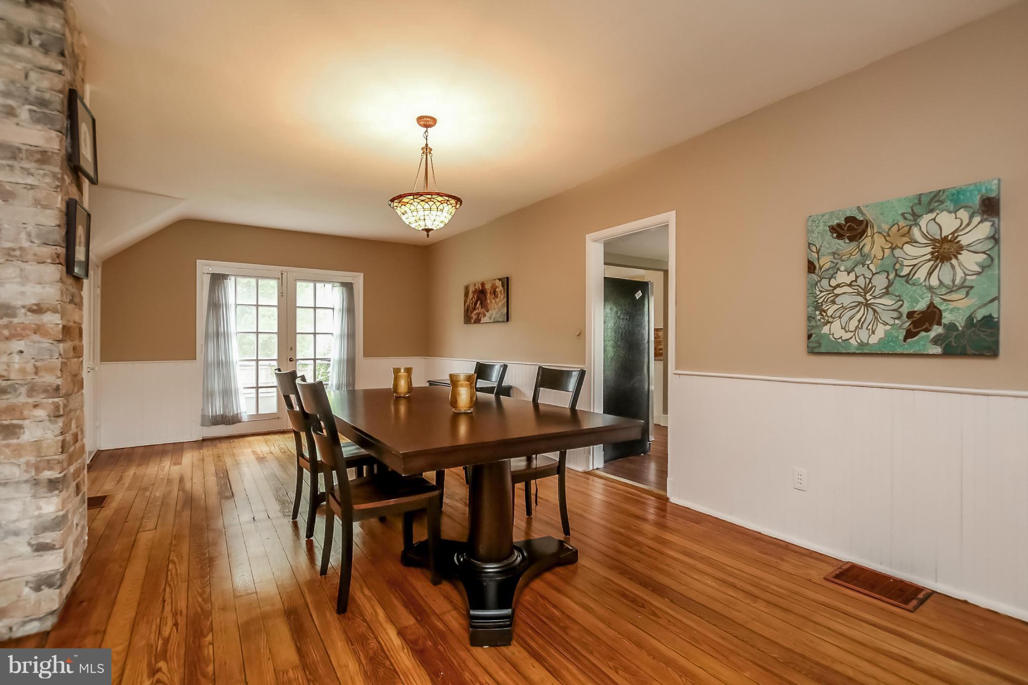 2429 Stanwick Road Phoenix, MD 21131 - Photo 9 of 30 a view of a dining room with furniture and wooden floor
