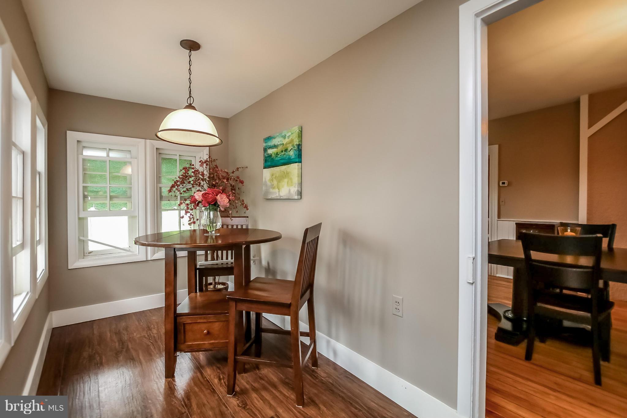 2429 Stanwick Road Phoenix, MD 21131 - Photo 10 of 30 a view of a dining room with furniture window and wooden floor