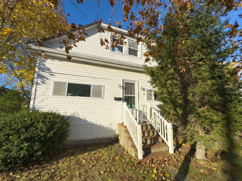 16 Ash Street Fairhaven, MA 02719 - Photo 2 of 25 a view of a house with a yard
