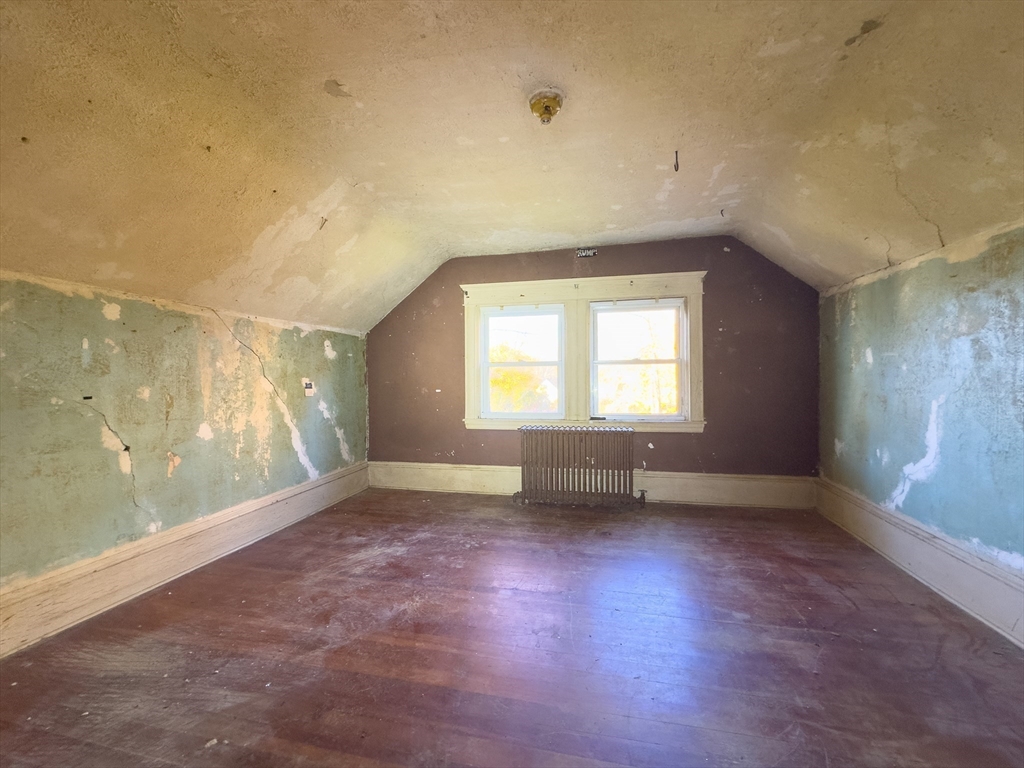 16 Ash Street Fairhaven, MA 02719 - Photo 21 of 25 an empty room with wooden floor and windows