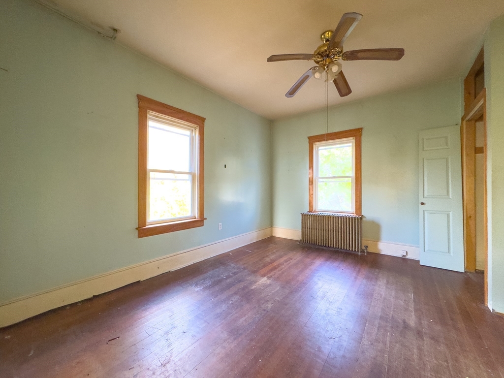 16 Ash Street Fairhaven, MA 02719 - Photo 7 of 25 a view of room with window ceiling fan and hardwood floor