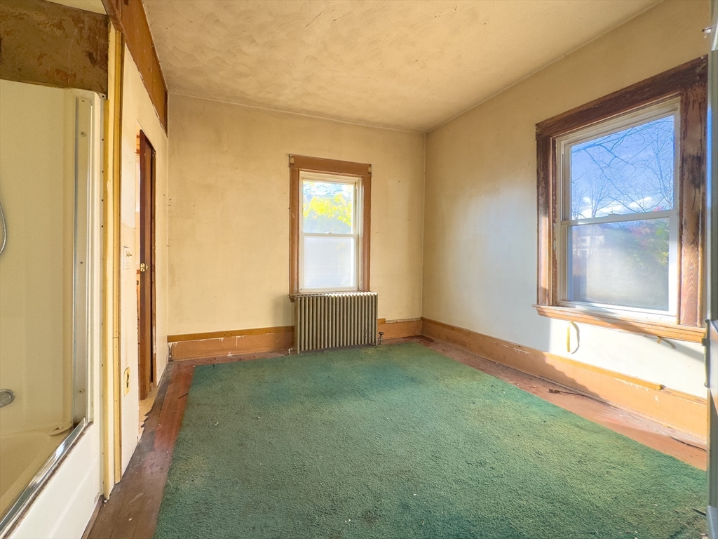 16 Ash Street Fairhaven, MA 02719 - Photo 8 of 25 a view of an empty room and window