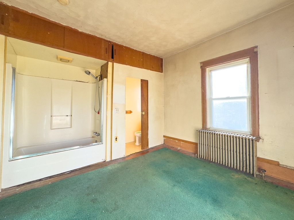 16 Ash Street Fairhaven, MA 02719 - Photo 9 of 25 a view of an empty room with a window