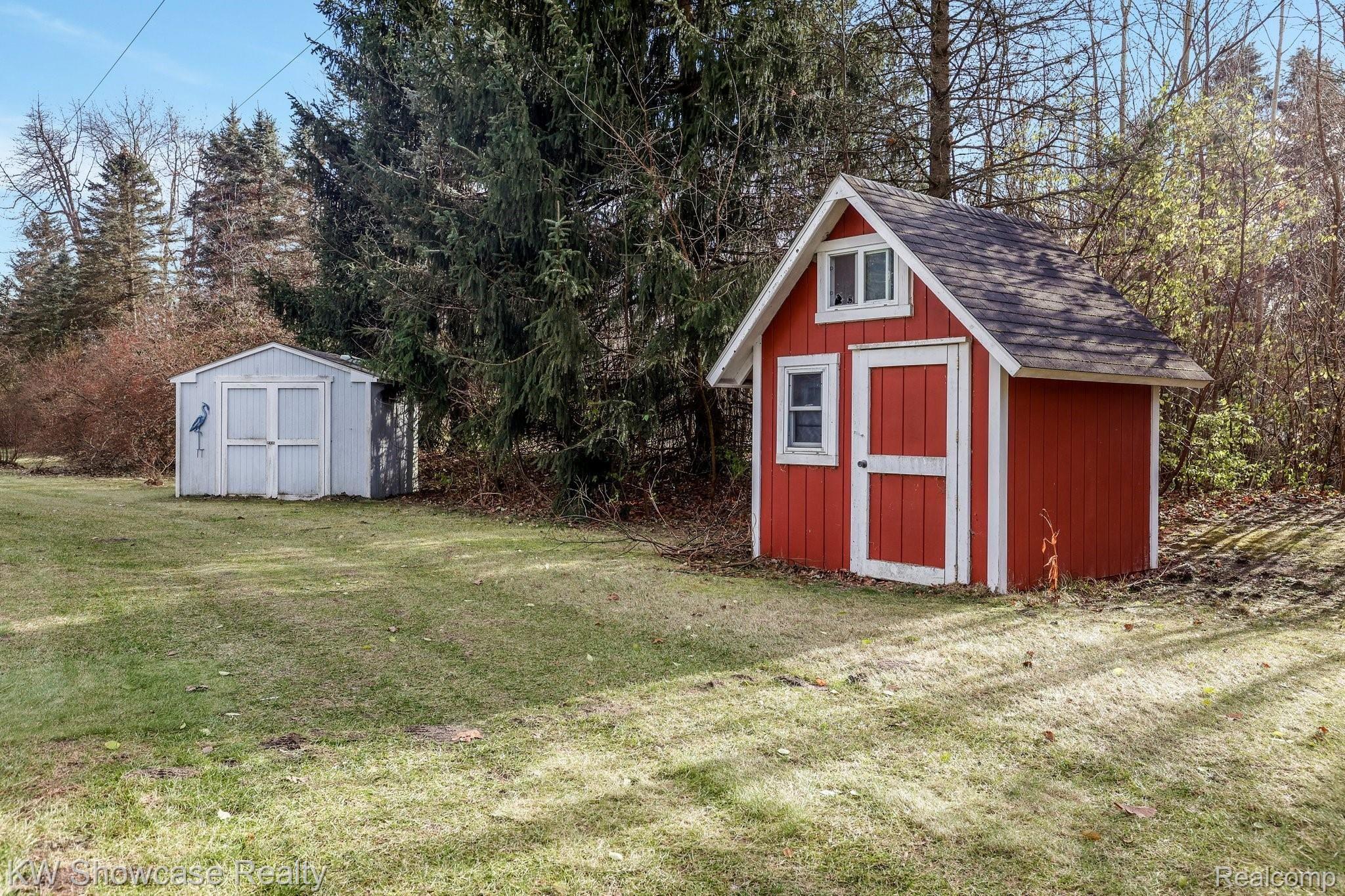 12382 Bunton Road Willis, MI 48191 - Photo 14 of 42 Several sheds on the property for additional outdoor storage.