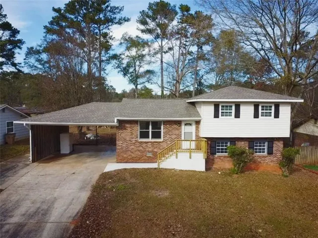 front view of a house with a yard